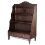 A REGENCY MAHOGANY WATERFALL OPEN BOOKCASE C.1810-15 inlaid with ebonised stringing and with