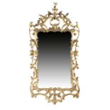 A GEORGE III GILTWOOD WALL MIRROR C.1770 the shaped plate within a rocaille, 'C' scroll, leaf and