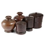 FIVE TREEN JARS AND COVERS 19TH CENTURY comprising: a near pair of globular jars, and three