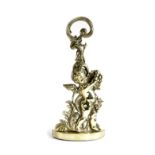 A BRASS BACCHANALIAN CHERUB DOORSTOP BY PEERAGE, EARLY 20TH CENTURY the leaf scroll handle above a