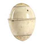 A GEORGE III BONE EGG SHAPE NUTMEG GRATER LATE 18TH CENTURY the screw-off lid revealing a steel