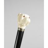 λ A LATE VICTORIAN IVORY HANDLED WALKING CANE LATE 19TH / EARLY 20TH CENTURY carved in the form of a