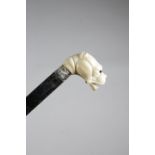 λ A LATE VICTORIAN IVORY HANDLED WALKING CANE C.1870-80 carved in the form of a bulldog's head, with