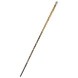 λ A RHINOCEROS HORN SWAGGER STICK LATE 19TH / EARLY 20TH CENTURY with a white metal handle and a