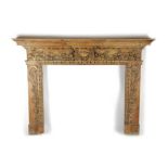 A CARVED PINE FIRE SURROUND / CHIMNEY PIECE IN GEORGE II STYLE 19TH CENTURY the breakfront mantel