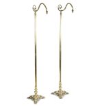 A PAIR OF VICTORIAN BRASS STANDARD LAMPS C.1890-1900 with a lappet scroll arm and a triform base (2)