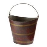 A TOLE NAVETTE SHAPE PEAT BUCKET 19TH CENTURY painted to simulate wood and brass, with a swing