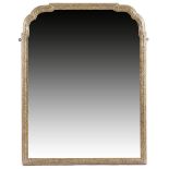 A GEORGE I GILTWOOD WALL MIRROR C.1715-20 the arched bevelled plate within a moulded frame carved
