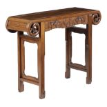 A CHINESE HARDWOOD ALTAR TABLE LATE 19TH / EARLY 20TH CENTURY the panelled top with scroll ends,