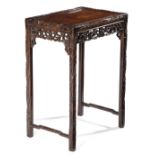 A CHINESE HARDWOOD OCCASIONAL TABLE LATE 19TH CENTURY formerly part of a nest of tables, carved with