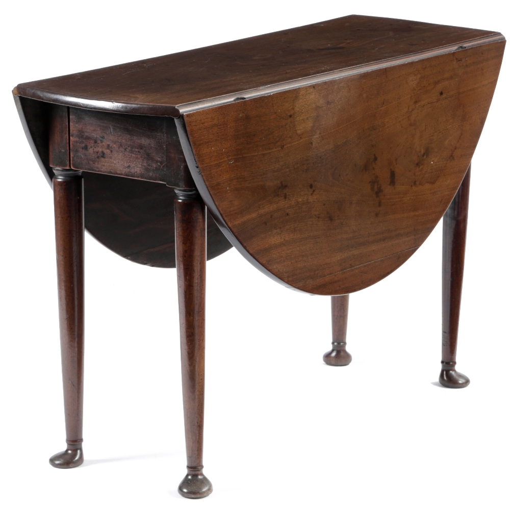 A GEORGE II MAHOGANY DINING TABLE C.1740 the oval drop-leaf top on turned club legs, with unusual