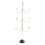 A MILLINER'S BRASS HAT STAND LATE 19TH CENTURY with a turned finial and stand and three pairs of