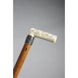 λ A LATE VICTORIAN IVORY HANDLED WALKING CANE LATE 19TH / EARLY 20TH CENTURY the handle with a