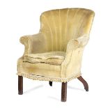 A MAHOGANY WING ARMCHAIR IN GEORGE III STYLE 19TH CENTURY upholstered with fringed plush fabric, the