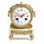 A REGENCY ORMOLU AND WHITE MARBLE MANTEL CLOCK RETAILED BY EMANUEL, C.1810-20 the brass eight day