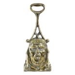 A VICTORIAN BRASS DOORSTOP C.1860 the handle decorated with Gothic trefoil arches, above the head of