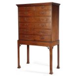 AN EARLY GEORGE III PADOUK SECRETAIRE CHEST ON STAND IN THE MANNER OF THOMAS CHIPPENDALE, C.1765-