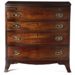 A LATE GEORGE III MAHOGANY BOWFRONT CHEST C.1800-10 the top with a reeded edge, above a baize