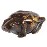 A TREEN FROG SNUFF BOX 19TH CENTURY with a painted finish and brass eyes, the underside with a