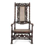 A WALNUT OPEN ARMCHAIR IN WILLIAM AND MARY STYLE 19TH CENTURY carved with crowns, shells and