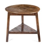 AN ASH CRICKET TABLE LATE 18TH / EARLY 19TH CENTURY the circular top on a triform base with an