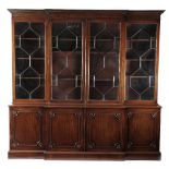 A GEORGE III MAHOGANY LIBRARY BREAKFRONT BOOKCASE C.1780 the later moulded cornice above geometric