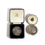 A GEORGE IV SILVER MEDAL AFTER F. MILLS, C.1827 with the relief profile bust of a Roman Emperor,