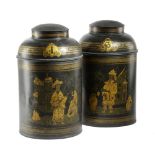 A PAIR OF BLACK JAPANNED TOLE TEA CANISTERS C.1870-80 decorated in gilt with chinoiserie scenes with