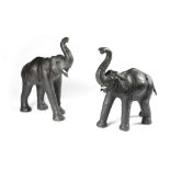 TWO LEATHER MODELS OF ELEPHANTS IN THE MANNER OF LIBERTY with faux ivory tusks (2) 71cm high, 61cm