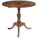 A GEORGE III YEW TRIPOD OCCASIONAL TABLE C.1770 the circular burr yew tilt-top on a vase turned stem