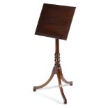 A REGENCY MAHOGANY READING TABLE C.1805-10 the hinged adjustable top with a reeded edge and a