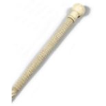 A SAILOR'S WHALEBONE SWAGGER STICK LATE 19TH CENTURY with a walrus ivory pommel, with a lattice