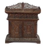 A BURMESE CARVED HARDWOOD CABINET MID-19TH CENTURY all over carved with scrolling foliage, with