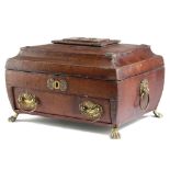 A LATE REGENCY RED LEATHER WORKBOX EARLY 19TH CENTURY with brass mounts, of sarcophagus shape, the