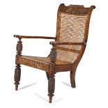 λ AN ANGLO-INDIAN ROSEWOOD PLANTER'S ARMCHAIR C.1850 with a gadrooned and scroll carved top rail,