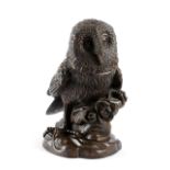 A CARVED WOOD OWL TOBACCO JAR with glass eyes and a hinged cover 29.5cm high
