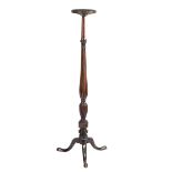 A MAHOGANY TORCHERE 18TH CENTURY ELEMENTS the circular dished top above a ribbed baluster stem, with