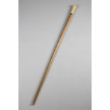 λ AN IVORY HANDLED WALKING CANE LATE 17TH / EARLY 18TH CENTURY the crown pique initialled 'I.B',