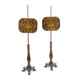 A PAIR OF REGENCY PENWORK POLE FIRESCREENS EARLY 19TH CENTURY the adjustable screen decorated with