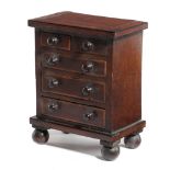 A MAHOGANY MINIATURE CHEST EARLY 19TH CENTURY possibly an apprentice piece, inlaid with stringing
