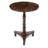 A GEORGE IV BURR YEW OCCASIONAL TABLE C.1830 the circular burr veneered segmented top on a turned