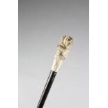 λ A JAPANESE IVORY HANDLED WALKING CANE MEIJI 1868-1912 carved with a crocodile devouring a snake,