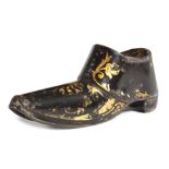 A REGENCY JAPANNED TOLE SNUFF SHOE C.1820 gilt decorated with leaf scrolls and palmettes, with a