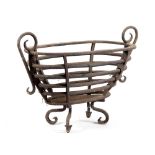 A WROUGHT IRON BASKET FIREGRATE of oval concentric tapering form and with scroll handles 43.3cm