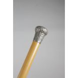 A SILVER HANDLED WALKING CANE BURMESE OR INDIAN, C.1880 the pommel handle repousse decorated with