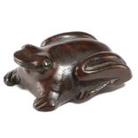 A SMALL TREEN FROG SNUFF BOX C.1860 with ebonised eyes, the underside with a hinged cover 5.7cm