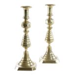 A LARGE PAIR OF VICTORIAN BRASS CANDLESTICKS C.1890-1900 with ejectors, each with a trumpet