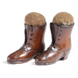 A PAIR OF TREEN NOVELTY PIN CUSHIONS MID-19TH CENTURY in the form of boots (2) 7.8cm high Provenance
