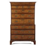 A GEORGE II BURR ELM AND WALNUT CHEST ON CHEST C.1730-40 with two short and six long cross and