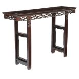 A CHINESE HARDWOOD ALTAR TABLE LATE 19TH CENTURY the rectangular panelled top above a pierced